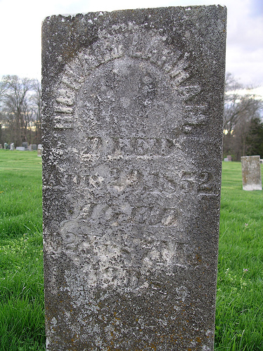 photograph of gravestone that is difficult to read